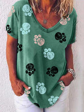 Load image into Gallery viewer, Camiseta feminina com estampa de pata de cachorro colorida