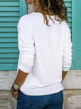 Load image into Gallery viewer, Loose-fit V-neck T-shirt with long sleeves