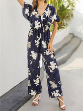 Load image into Gallery viewer, Macacão folgado com estampa floral e cintura alta com decote em V
